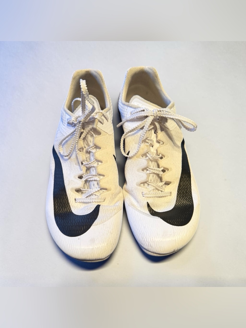 Nike White Track Cleats with Black Swoosh